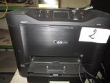 a canon printer that is sitting on a table