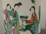two vases that are decorated with asian women
