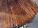 a large round table with two chairs around it