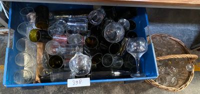 many empty wine glasses and bottles in a blue box