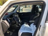 a car with a bag in the back seat of it
