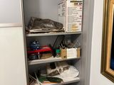 a picture of a closet with a lot of stuff on the shelves