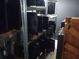 a room with a lot of computer equipment on the shelves