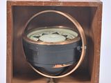 a wooden box with a clock inside of it