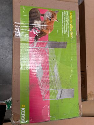 a box with a cat inside of it on the floor