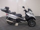 a picture of a motor scooter parked in a garage