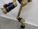a picture of a robot with a camera attached to it ' s arm