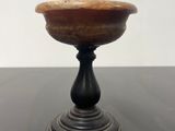 an image of a wooden bowl sitting on top of a black table