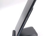 a cell phone that is on a stand on a table