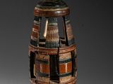 a vase that is made out of books on a table