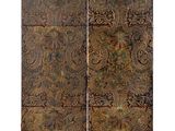 a pair of decorative metal panels with paisley designs on them
