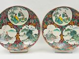 pair of chinese plates with birds and flowers on them
