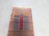 a rug on the floor that has a red door on it