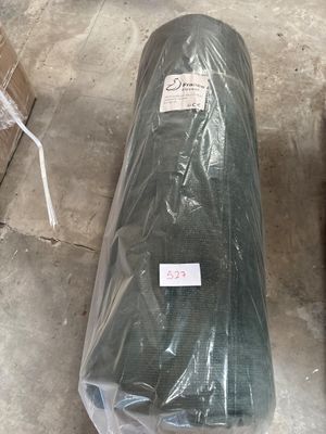 a large roll of plastic sitting on the floor
