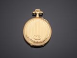 an image of a gold pocket watch on a black background
