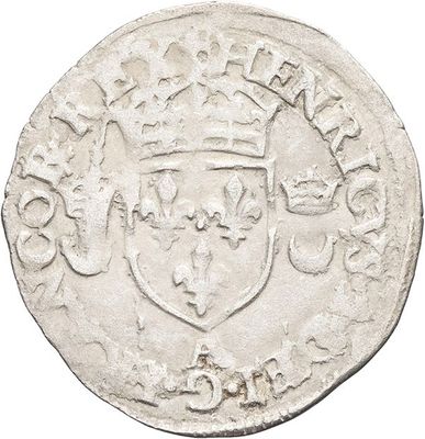 an old silver coin with a crown on top of it