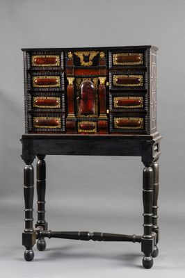 an image of a black and gold chest of drawers