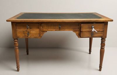 a wooden desk with two drawers and a green top