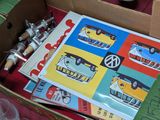 a cardboard box filled with assorted items on a table