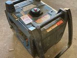 a small machine that is on the ground in the garage