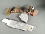 some rocks and a knife are sitting on a table