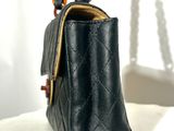 a black purse with a chain hanging from it