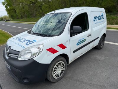 a white van that is parked on the side of the road