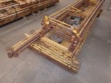many pieces of wood stacked on top of each other in a warehouse