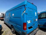 a blue van that is parked in a lot