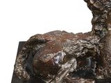 statue of a dog and a cat on a black marble base