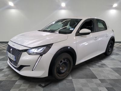 the white car is parked on a checkered floor in a room
