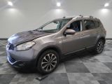 a picture of a silver nissan suv in a showroom