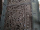 a door with a decorative design on it in a room