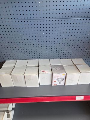 many boxes on a shelf in a store