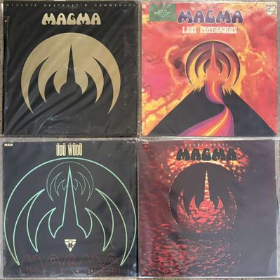 four cd ' s of various albums, including the band ' s logo