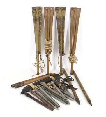 several different types of weapons are laid out on a white surface