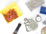 many different types of watches and other items on the table