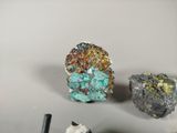 three different types of rocks on a white surface