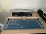 an image of a desk with a printer, scanner, and printer