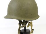 an image of a helmet on a stand on a white background