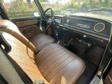 a view of the inside of a car from the driver ' s seat