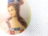 a picture of a woman with a blue flower in her hair