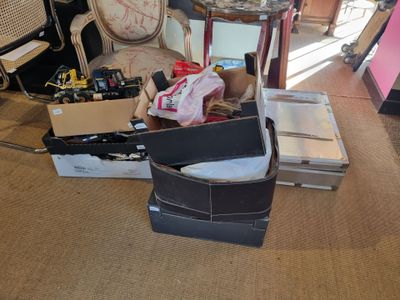 a pile of boxes and other items on the floor