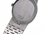 a watch that is sitting on a metal bracelet