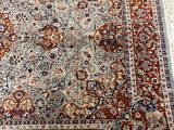 a close up of a rug on a white surface