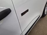 a close up of a car door with a sticker on it
