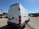a white van that is parked in a parking lot