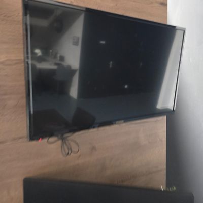 a flat screen tv mounted on a wall in a living room