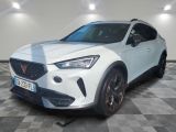 a white car is parked in a room with checkered floor