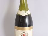 a bottle of wine that is sitting on a table